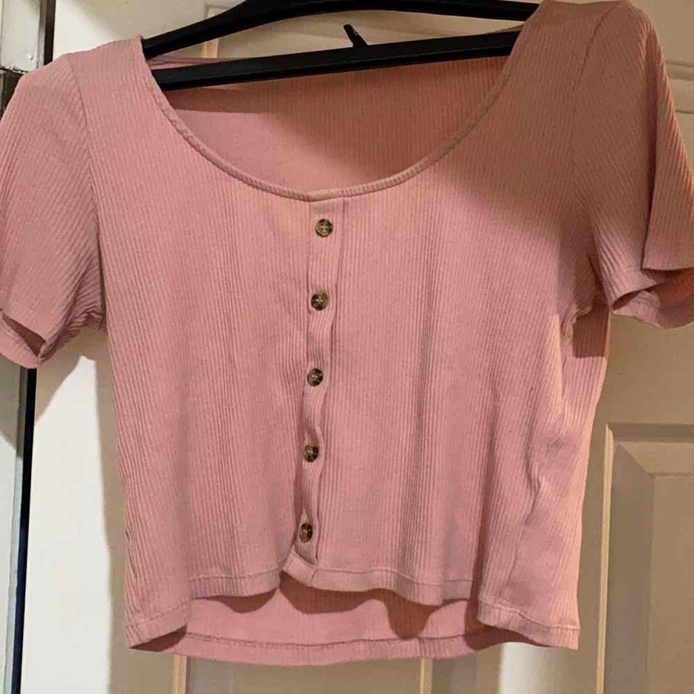 Salmon colored women’s crop top